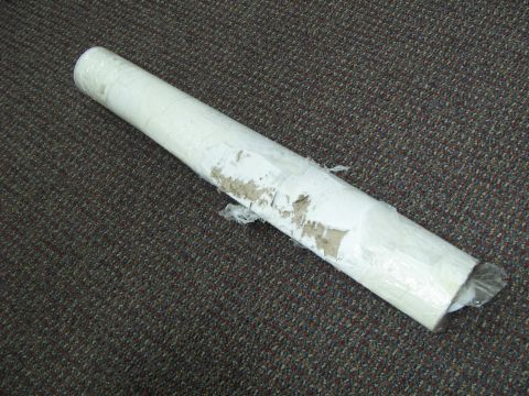 1971 Ford Ranchero - A long, cylindrical object wrapped in protective material sits on a carpeted surface. A website logo is visible in the lower right corner.