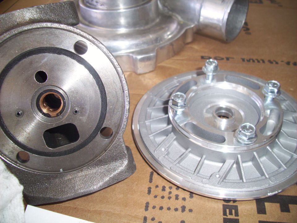 Close-up of turbocharger components, including a housing and a turbine wheel assembly