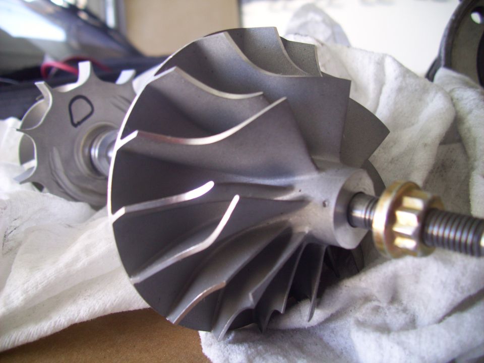 Turbocharger compressor wheel with brass nut and threaded shaft
