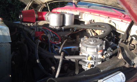 1978 Ford Bronco - The engine bay shows a propane conversion system installed on the vehicle.