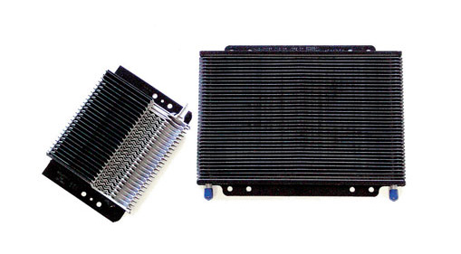Two black transmission coolers against a white background. One is angled, showing stacked fins. The other is rectangular with blue fittings