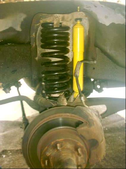 1980 Ford Bronco - Drivers side reassembled with new monroe gas shock and new coil spring.