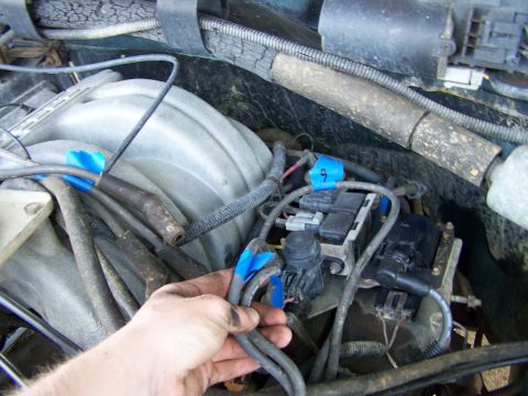 1992 Ford Bronco - Close-up view of engine bay components, including wiring and electrical modules.