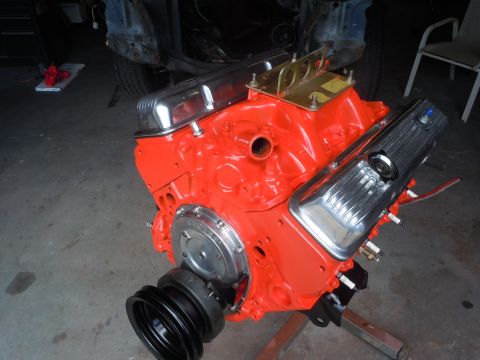 1973 Chevrolet Camaro - A freshly painted V8 engine sits in a garage, ready for installation into a vehicle.
