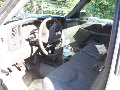 1994 Ford F-150 - The interior of a truck cab is visible, the dashboard, steering wheel, and seats.