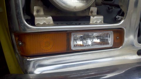 1978 Ford Bronco - Close-up of the front grille and lighting assembly of a 1978 Ford Bronco.