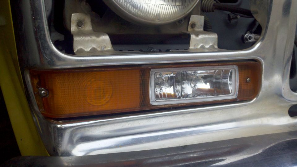1978 Ford Bronco front grille with chrome bumper, amber turn signal, and rectangular headlight