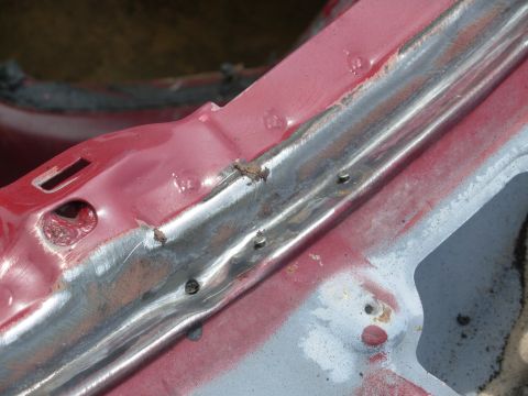 1983 Ford Bronco - There were obvious indications of ongoing leaks near the firewall, so I removed all the old windshield adhesive. I didn't notice these drai…