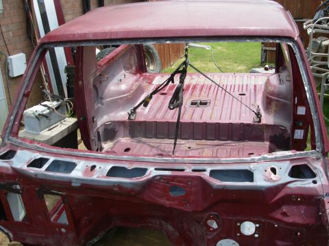 1983 Ford Bronco - There were obvious indications of ongoing leaks near the firewall, so I removed all the old windshield adhesive, paint & factory seam seale…