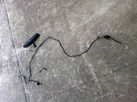 1996 Ford Bronco - This is a wiring harness and rearview mirror assembly, likely removed from a vehicle's interior.