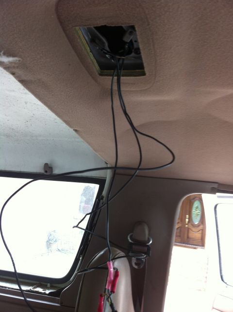 1996 Ford Bronco - Wiring is exposed from an open overhead console in the vehicle's interior.