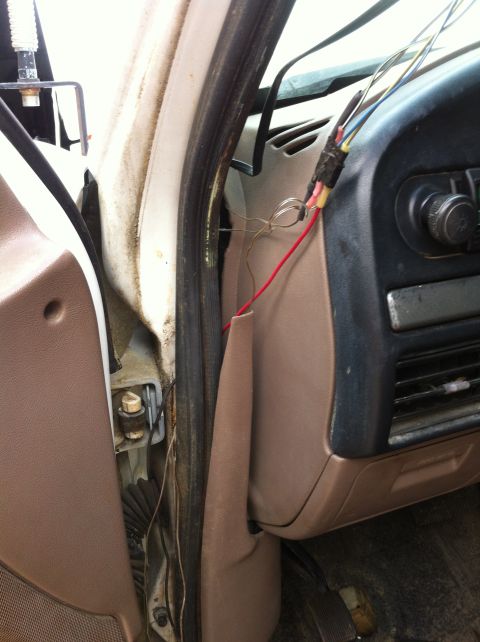 1996 Ford Bronco - Exposed wiring and interior components are visible near the dashboard and door jamb.