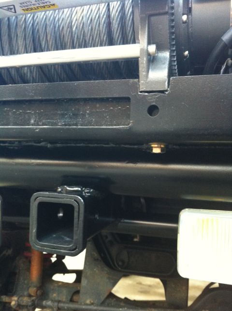 1996 Ford Bronco - Close-up of a winch and trailer hitch receiver, with caution text visible.
