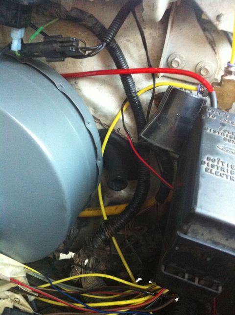 1996 Ford Bronco - Engine bay wiring and fuse box detail, showing various electrical connections and conduits.
