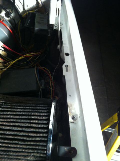 1996 Ford Bronco - Close-up view of an engine bay, showing a complex wiring harness and an air filter assembly.