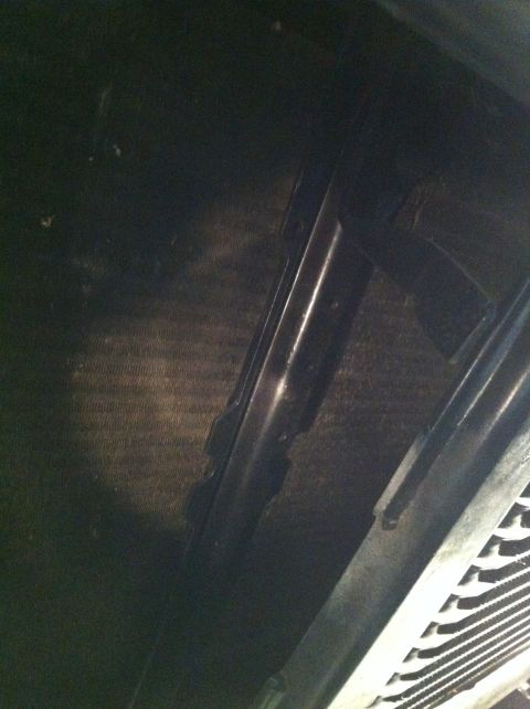 1996 Ford Bronco - Close-up view of radiator and fan shroud assembly.
