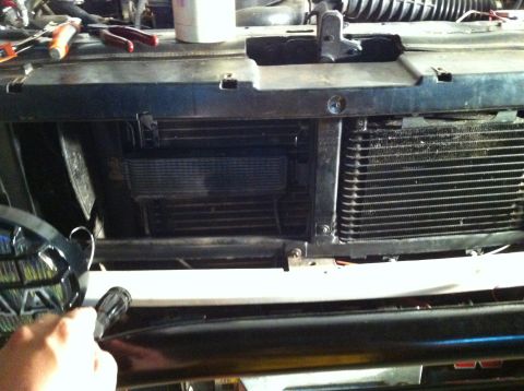 1996 Ford Bronco - Close-up view of the power steering cooler assembly, likely during maintenance or repair.