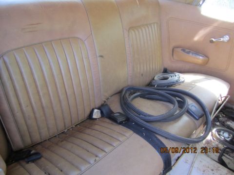1968 Mercury Cougar - Interior rear seat with tan upholstery and coiled weatherstripping.