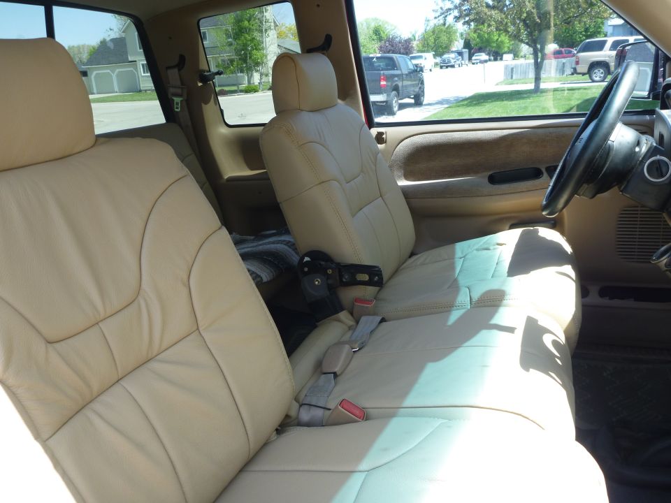 1997 Dodge 2500 interior showing tan leather front seats and dashboard