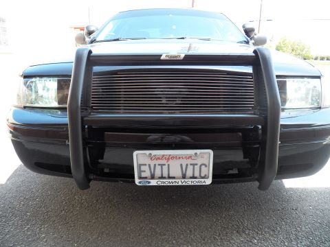 2003 Ford Crown Victoria - Black police-style sedan front grille guard, billet grille and personalized EVIL VIC license plate
