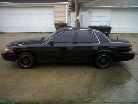 1999 Ford Crown Victoria - Side profile of a black 1998 Ford Crown Victoria parked in a driveway.