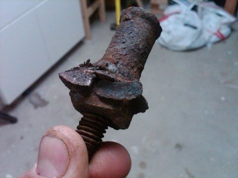 1986 Ford Bronco - This heavily rusted bolt is being held up for inspection.