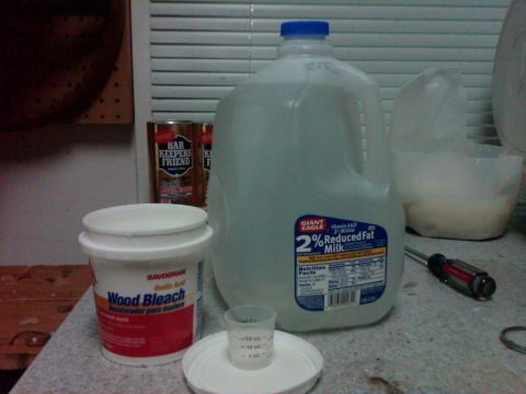 1986 Ford Bronco - Cleaning supplies and milk are gathered on a counter, possibly for a DIY project.