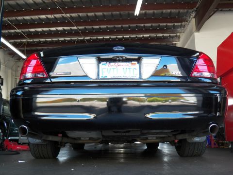 2003 Ford Crown Victoria - Rear view of a black Crown Victoria, plate frame reading CROWN VICTORIA around EVIL VIC tag.