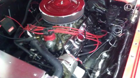 1964 Ford Fairlane - Close-up view of a vehicle's engine compartment, showing various components and wiring.
