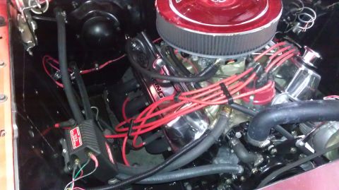 1964 Ford Fairlane - The engine bay of a 1964 Ford Fairlane shows a V8 engine with updated components.