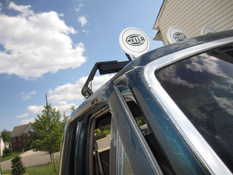 1992 Ford Bronco - The vehicle has a roof rack with multiple Hella lights attached, seen from the side.