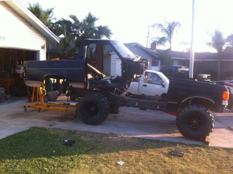 1989 Ford Bronco - Ford Bronco body is being fitted onto a custom chassis, with a Toyota pickup cab in place.
