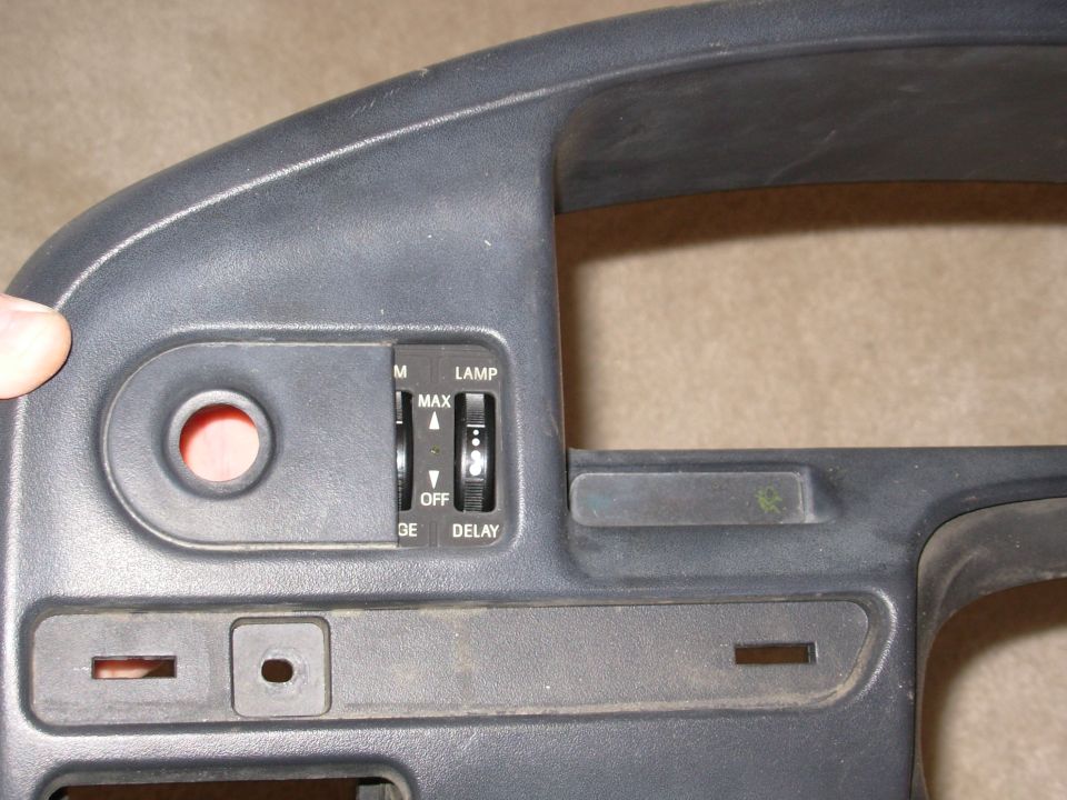 Gray dashboard bezel with headlight switch controls labeled MAX, OFF, LAMP, DELAY