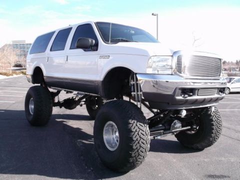 2001 Ford Excursion - This heavily modified Ford Excursion SUV features an aftermarket grille and significant suspension lift.