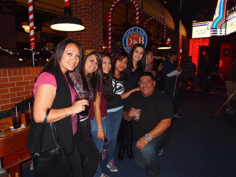 2012 Ford Bronco - A group of friends gathered at Dave & Buster's, enjoying drinks and the atmosphere.