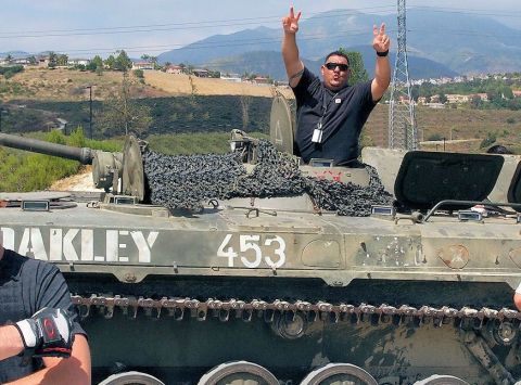 2012 Ford Bronco - Man in a tank, possibly a BMP, with Oakley branding and the number 453 visible.