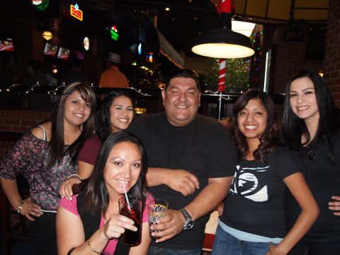 2012 Ford Bronco - A group of five people pose for a photo while gathered at a bar.