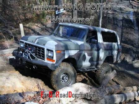 1979 Ford Bronco - Camouflaged Ford Bronco navigates a challenging off-road course.