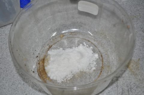 1986 Ford Bronco - A close-up view of a white powdery substance inside a glass container.
