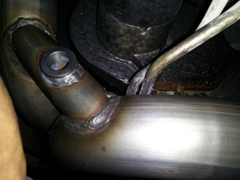 1995 Ford Bronco - transmison lines resting ontop of y pipe, and this isnt even when the y pipe is completely bolted on, so when it is, the tranny lines will…