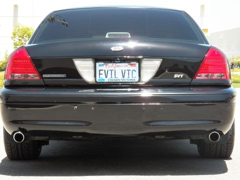 2003 Ford Crown Victoria - Tight rear shot of a black Crown Victoria, EVIL VTC plate in a Crown Victoria frame.