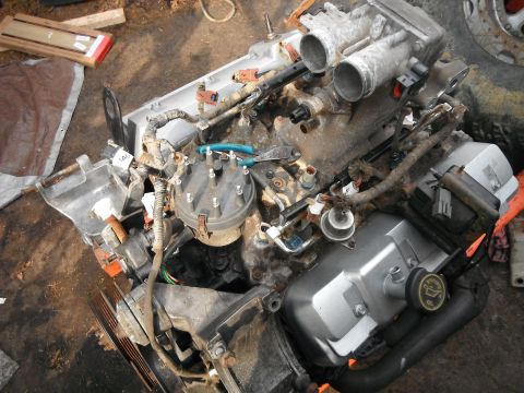 1988 Ford Bronco - Engine assembly with distributor, fuel injectors, and valve cover visible.