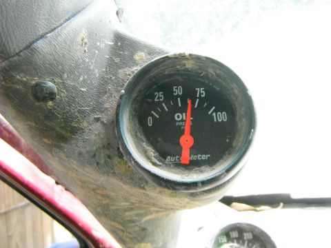 1988 Ford Bronco - Close-up of an Auto Meter oil pressure gauge showing 75 PSI.