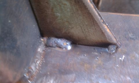 1979 Ford Bronco - Close-up view of a welded metal joint, likely a part of a vehicle's frame or body.