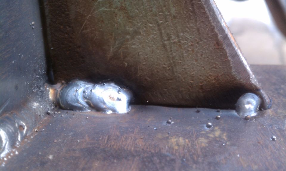 Close-up of metal parts joined by welds