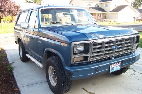1980 Ford Bronco - This blue Ford Bronco, likely a 1978 model, is shown from a three-quarter front angle.