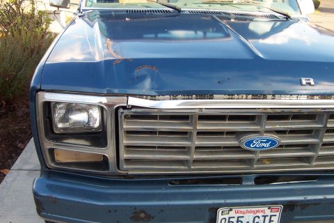 1980 Ford Bronco - Front view of a blue 1980 Ford Bronco, showing the grille, headlights, and Ford emblem.