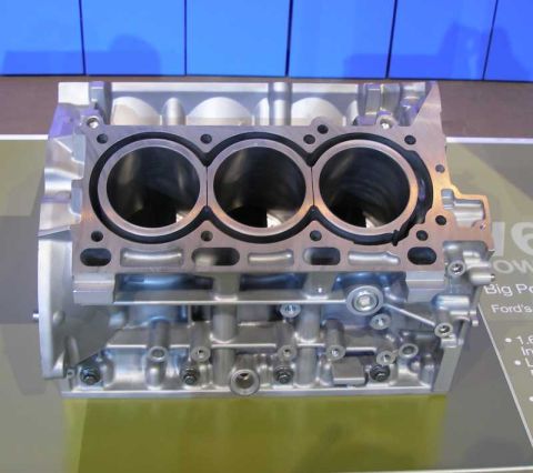 1997 Ford Taurus - Close-up view of an engine block, likely a V6 configuration, with visible cylinder bores and internal components.