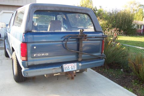 1980 Ford Bronco - Rear view of a blue 1980 Ford Bronco, equipped with a spare tire carrier and a Washington license plate.