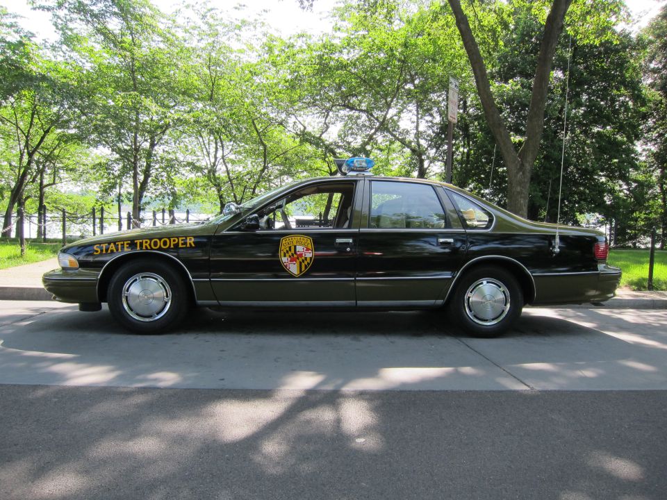 Black Maryland State Trooper Chevrolet Caprice sedan, side view outdoors